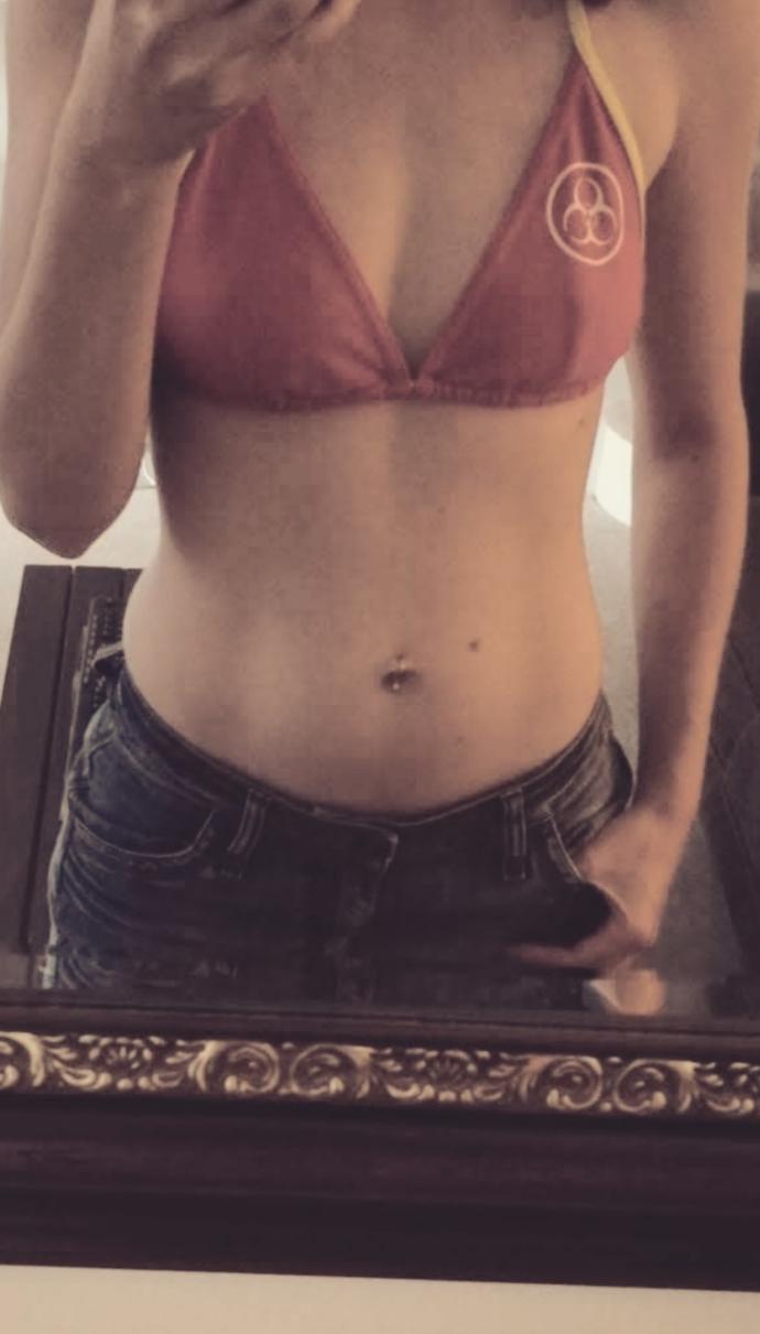 My girlfriend bought a fake belly piercing. she's thinking of getting a real one. But she's not sure what looks better. Piercing or no piercing??