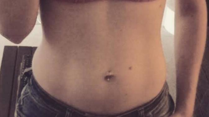 My girlfriend bought a fake belly piercing. She's thinking of getting a real one. But she's not sure what looks better. Piercing or no piercing?