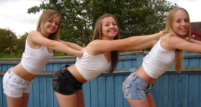 Which of these shorts looks the best for the white shirts that each of these females are wearing?