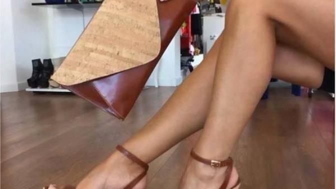 What do you think about this woman's shoes and pocketbook color combination matching and do you like her tattoo?
