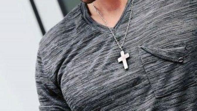 Have you ever worn a Christian cross necklace and was there an emblem of Jesus or His name displayed on it?