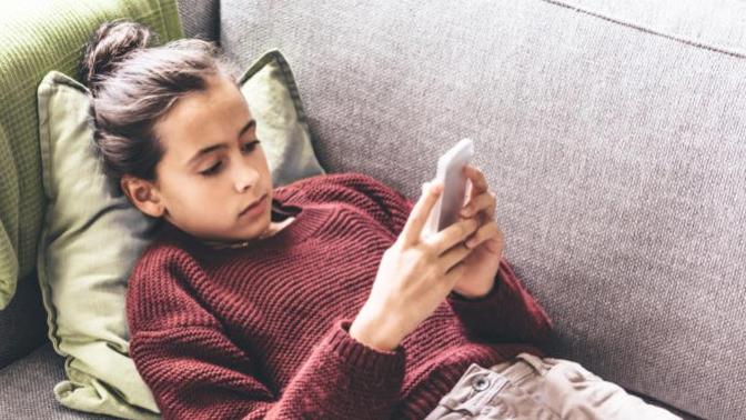 What problems are cell phones and wireless devices causing in children?