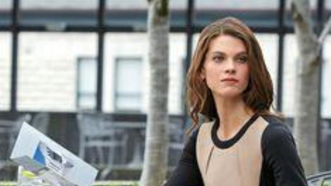 What do you think this woman is holding and is this a nice outfit?