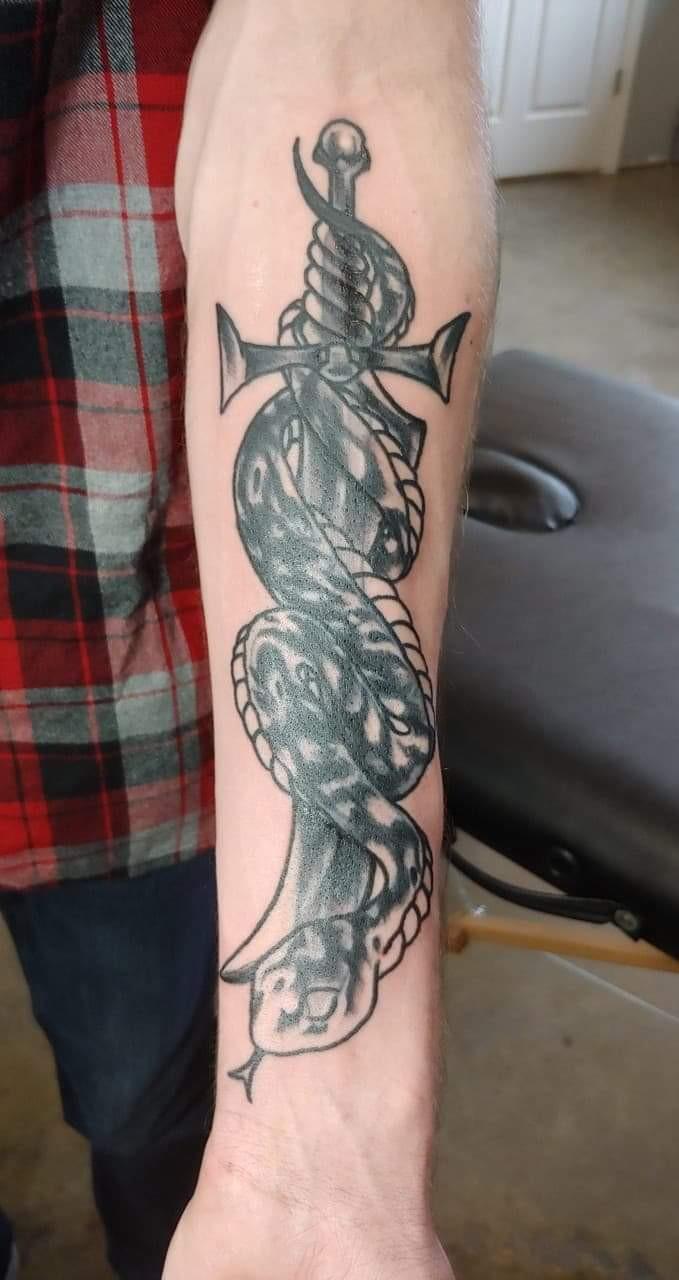 Guys, would you date a woman with tattoos?