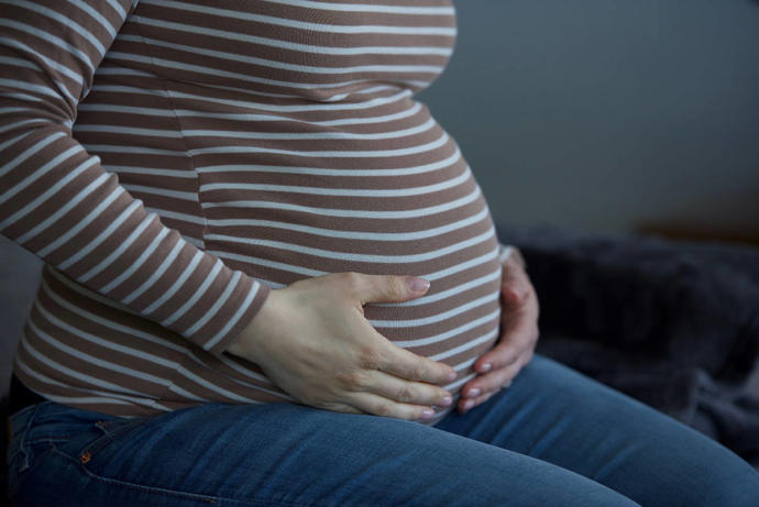 My sister is pregnant, and shes due near my wedding date. Should I ask her not to go?