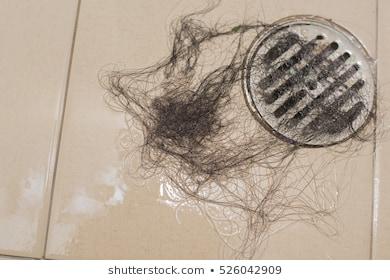 Hair shedding on the bathroom floor and clogged drains?
