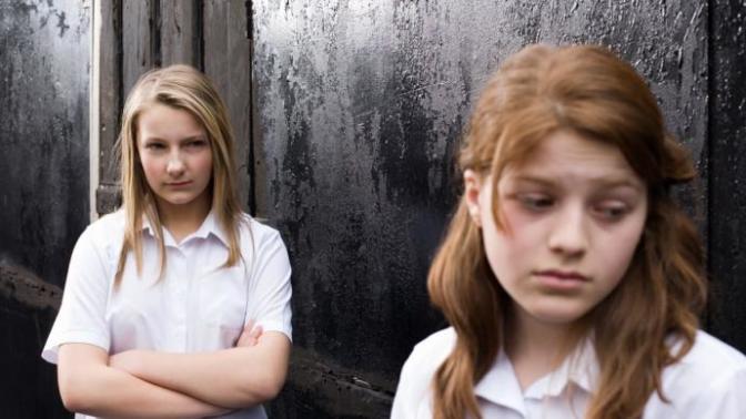 The guy I like is friends with my childhood bully. What should I do?