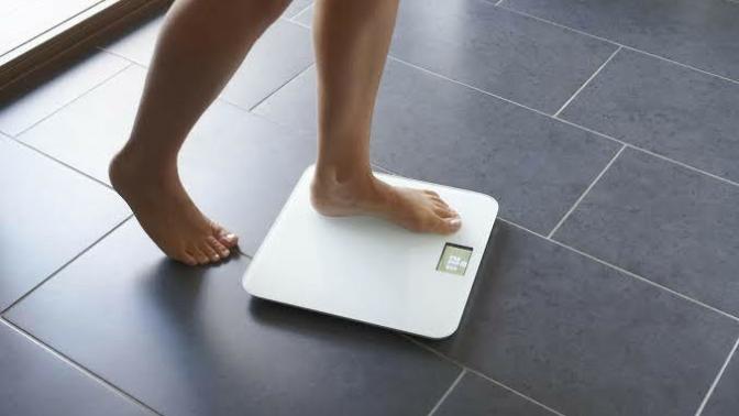 Should I check my weight daily or weekly?