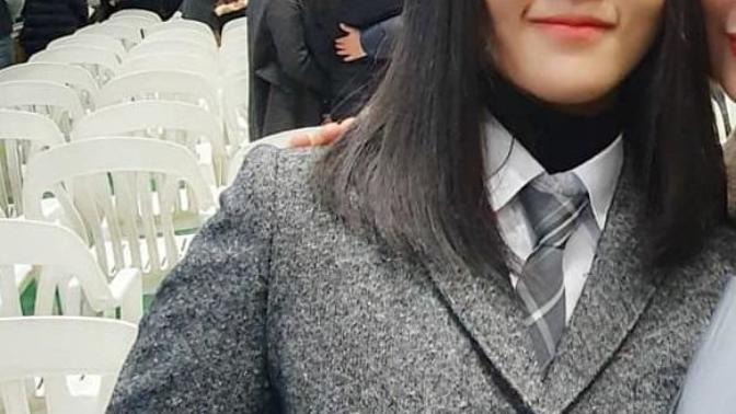 Could adding a turtleneck under a shirt and tie make the outfit more feminine?