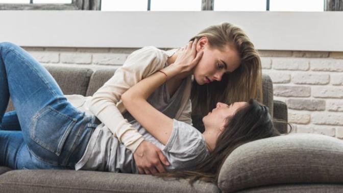 Is it more acceptable for you to see girls kissing each other in a romantic way or to see guys doing it?