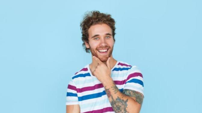 Why does a guy touch his chin when checking out and flirting with a girl?