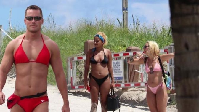 Guy wears womens bikini to the beach. Is he?