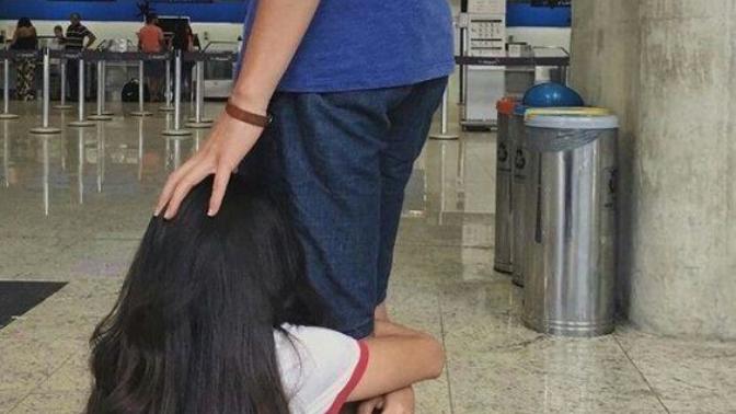 Why did brother's girlfriend beg him not to leave at airport?