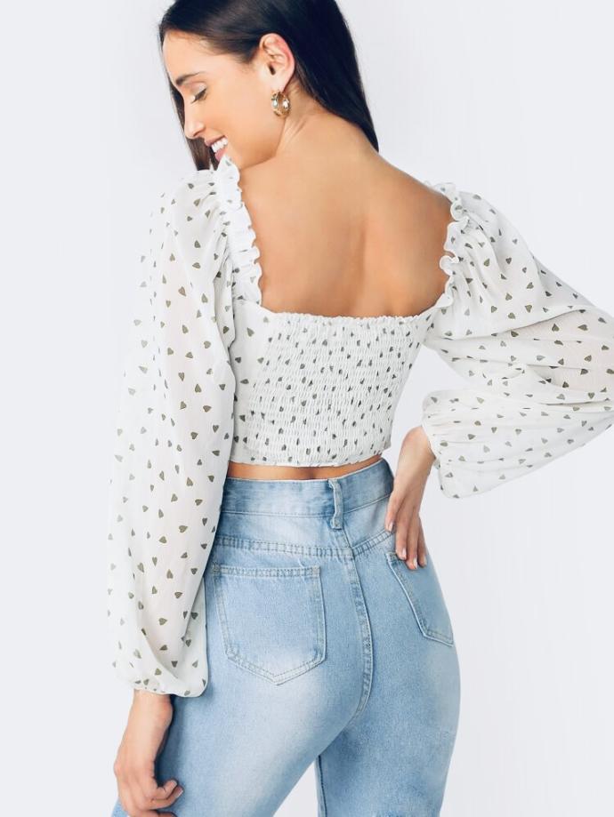 Which shirt do you like better with mid rise flare jeans ( not the ones she’s wearing) and black boots?