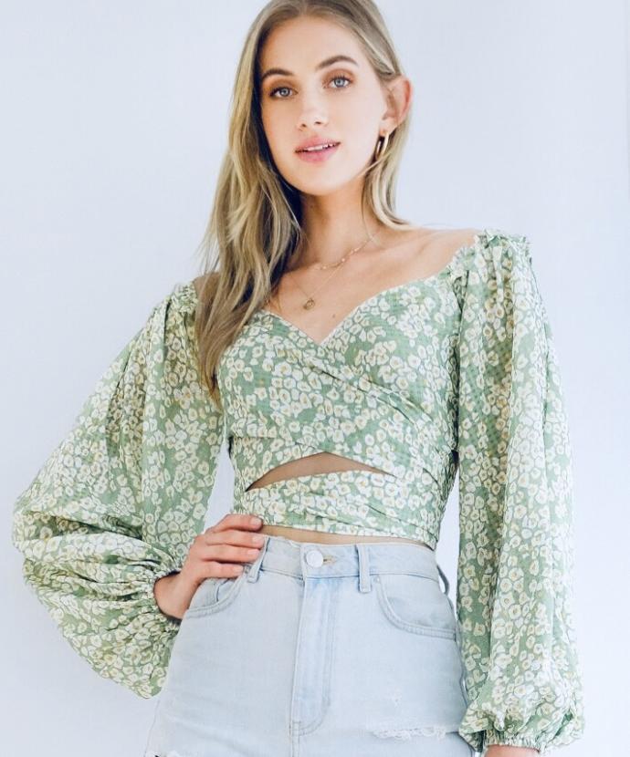 Which shirt do you like better with mid rise flare jeans ( not the ones she’s wearing)  and black boots ?