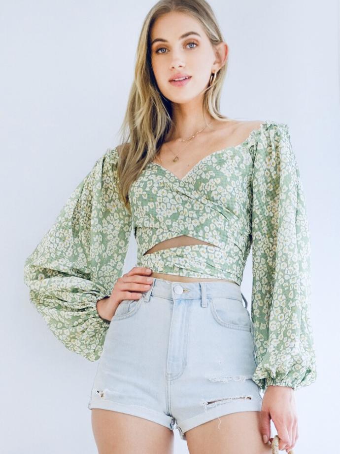 Which shirt do you like better with mid rise flare jeans ( not the ones she’s wearing) and black boots?