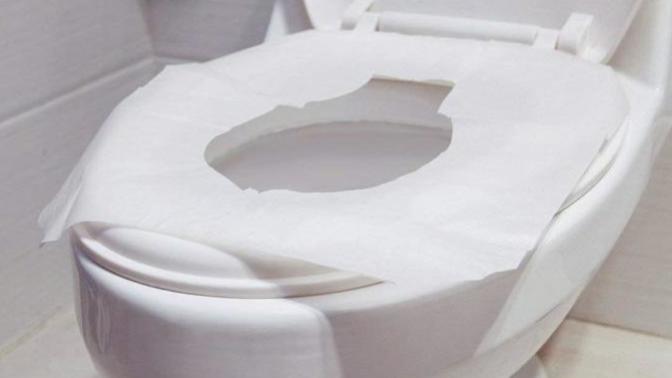 Should you use toilet seat covers while pooping in public restrooms?