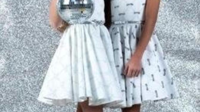 What type of ball is this girl holding and why isn't the other girl holding a ball?