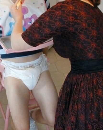 Zakipoo being fed by my mom in his highchair lol