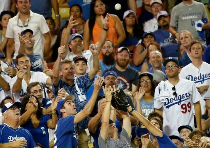At a MLB game, is it rude to ask a fan who catches a foul or home run ball if you can have the ball?