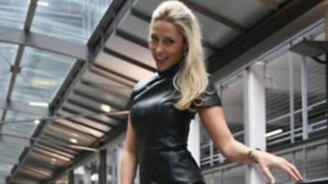 Which woman rock the leather dress and boots style the most?
