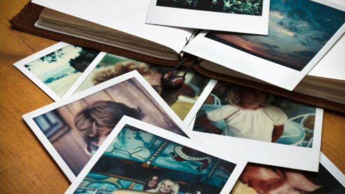 Let's say a guy used to have a hobby of taking erotic photography, and his current girlfriend wants him to get rid of his work, what should he do?