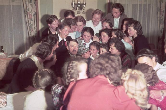 Why are women more attracted to men who are surrounded my many females than man who are not?