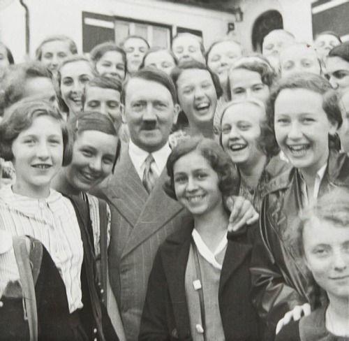 Why are women more attracted to men who are surrounded my many females than man who are not?