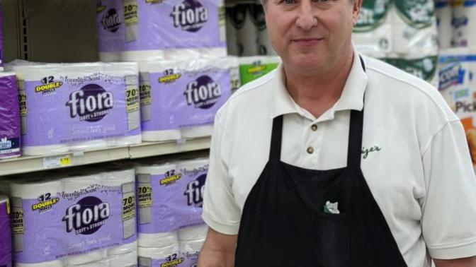 Why do grocery/super market staffs wear apron?
