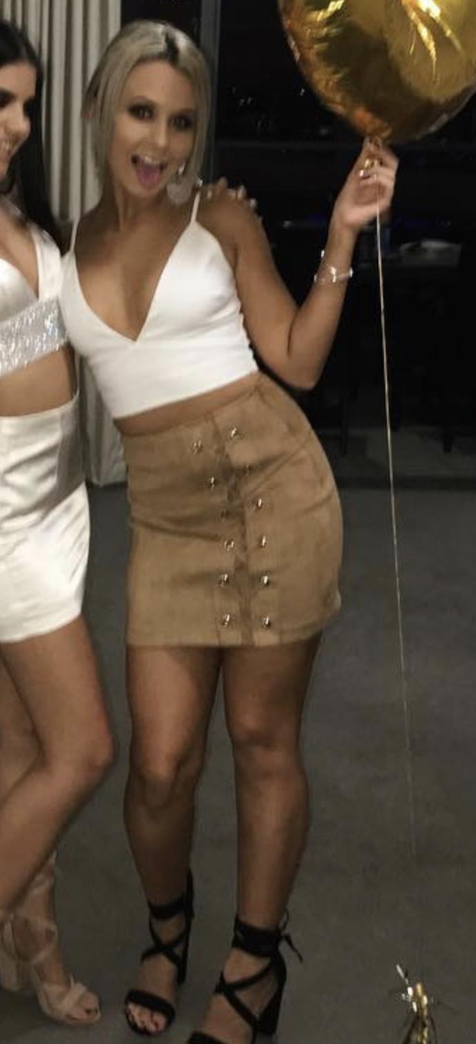 Which of these women seems to be wearing the most comfortable clothing style?