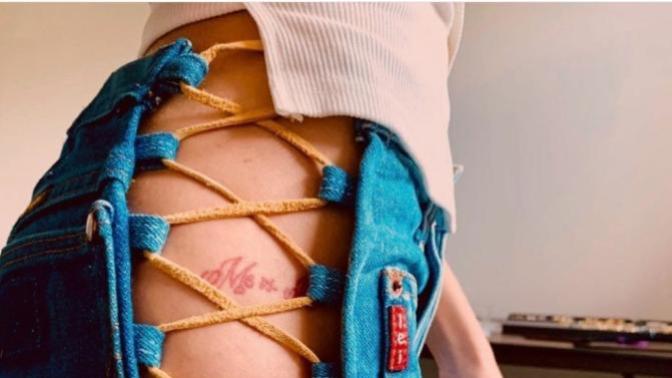 Would her pants be the only thing to have to come off for this tattoo to have been done? Also is she not wearing underwear in this pic?