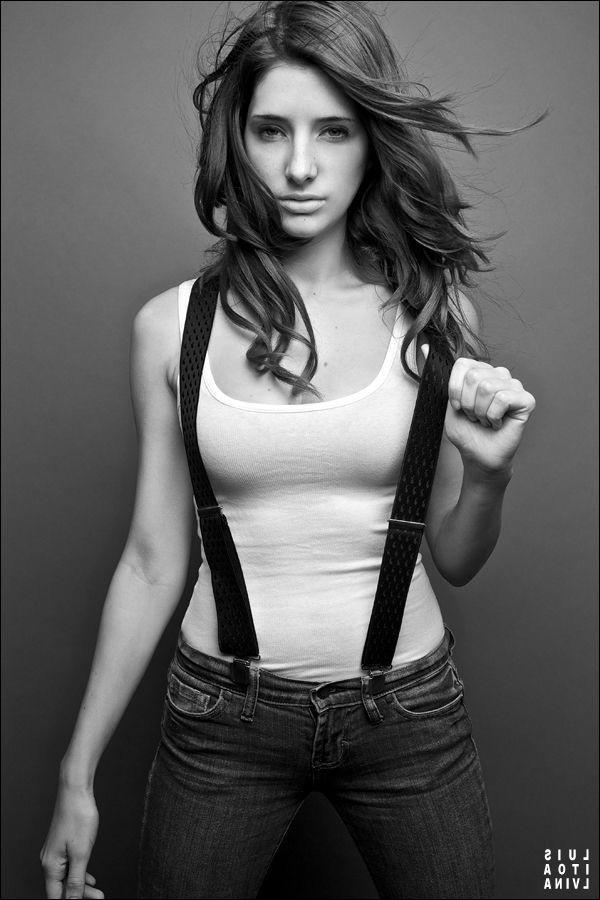 Which picture of a girl in suspenders is the most interesting?