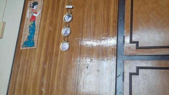 Can anyone suggest how can I decorate this plain wooden wall in my room?