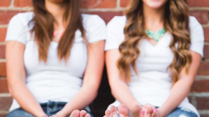 Graduation year written on bare soles in senior photos - why do they do that?