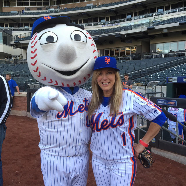 Linda Cohn pictured with Mister Met