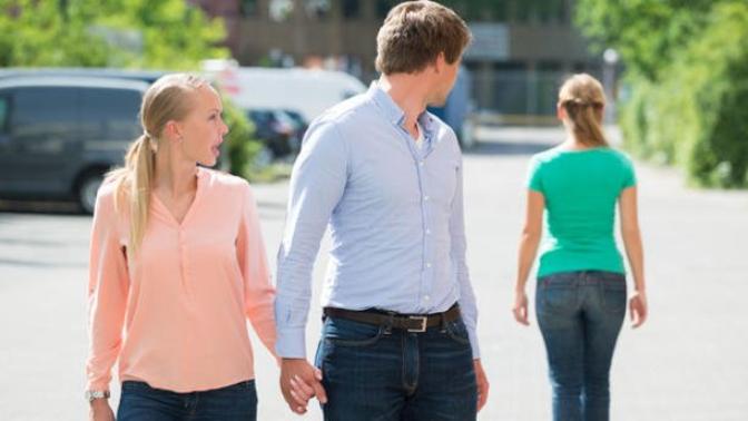 Is checking out other women normal guy behavior or the behavior of a cheater?