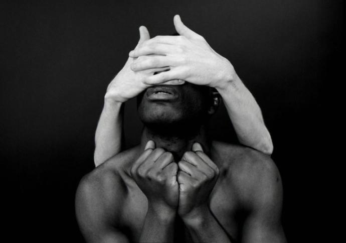 Do you think the hands that are covering up this mans eyes are of a man or of a woman?