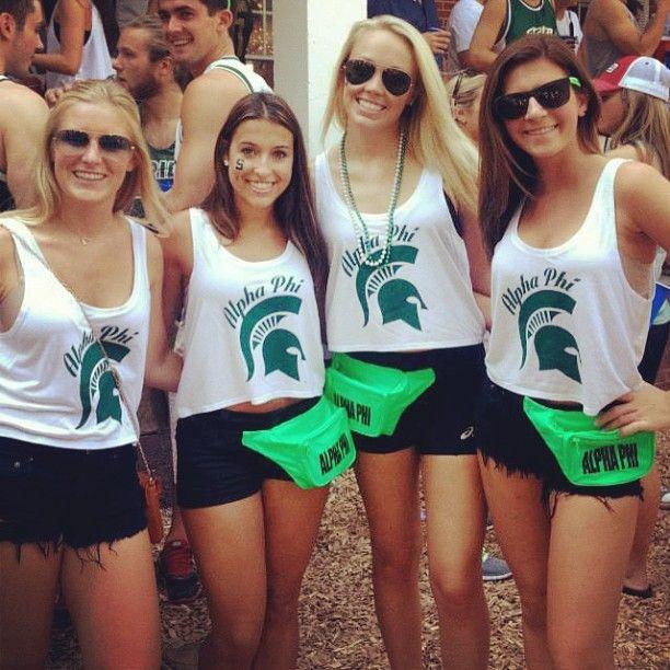 Which quartet (group of 4) of Michigan State Spartans versus Michigan Wolverines women has the better outfits?