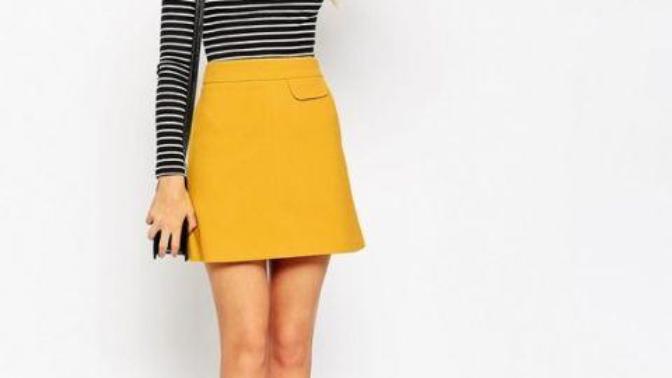 Which of these women wearing yellow skirts has the best outfit?