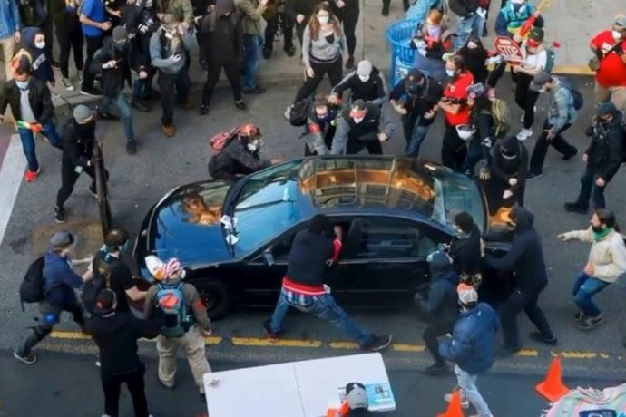 If a bunch of people surround your car, should you be allowed to do the following?
