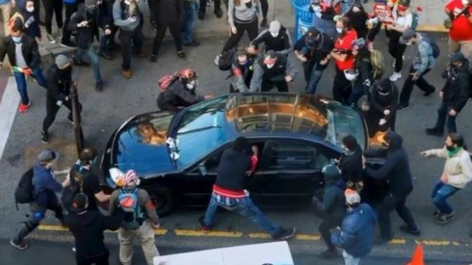 If a bunch of people surround your car, should you be allowed to do the following?