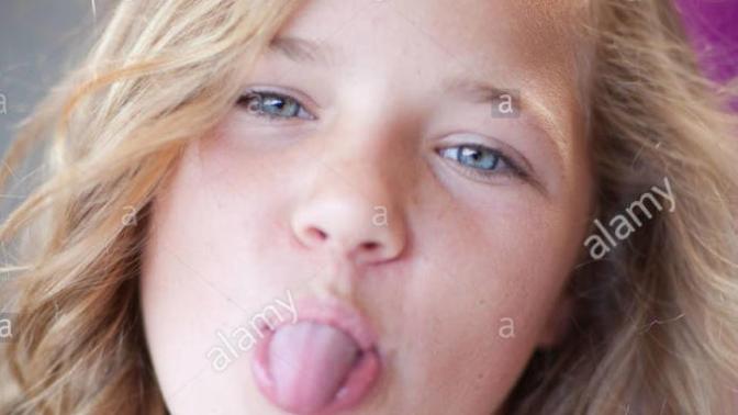 TO anyone with a mid-line tongue piercing, can you stick your tongue out in the way the girls below are?