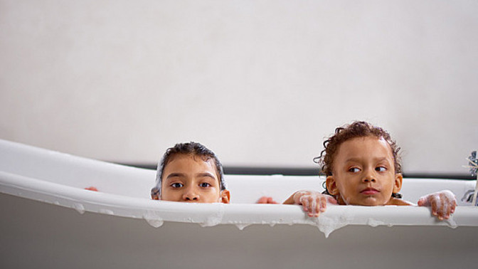 Is it wrong if I let my 11 y old daughter take baths with her 7 year old brothers?