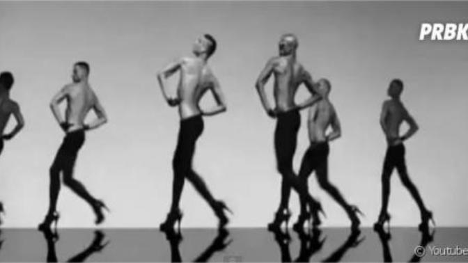 Why do singers make men in heels appear in their music videos?