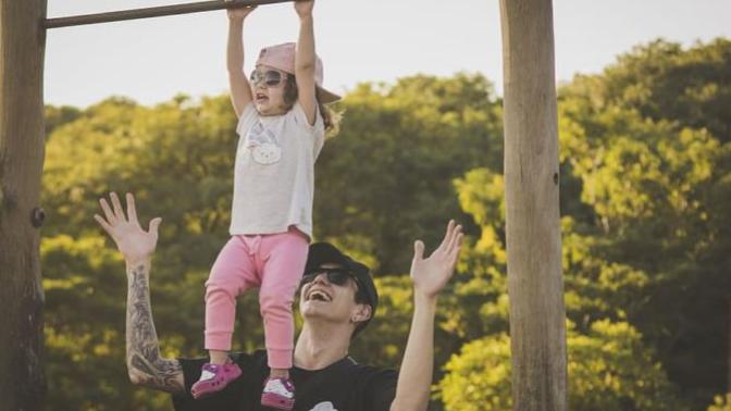 Should I help the child on to the monkey bars?
