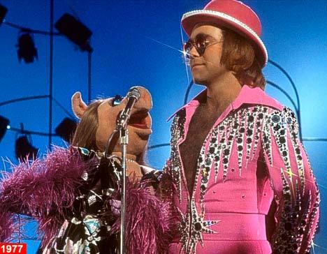 Elton donning his gay apparel tra la la