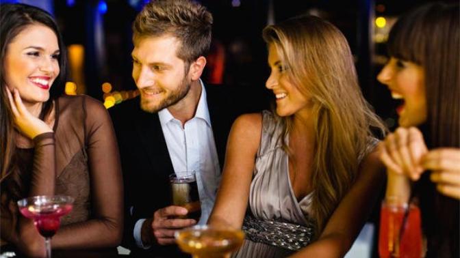 Why does a man approaching a woman look safer if he's with a female friend rather than with a male friend?