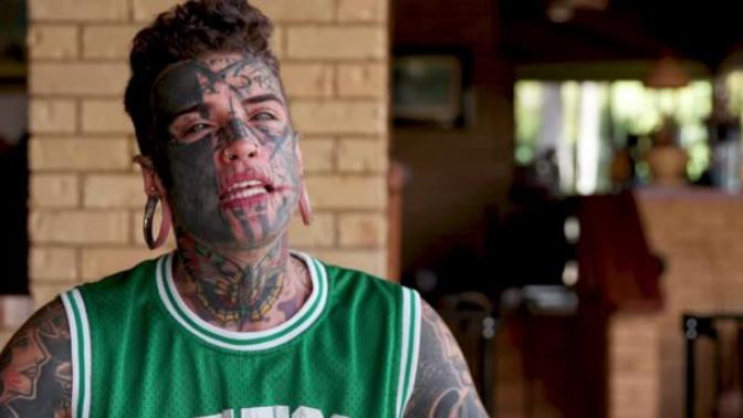 Why do guys mar their bodies with tattoos?
