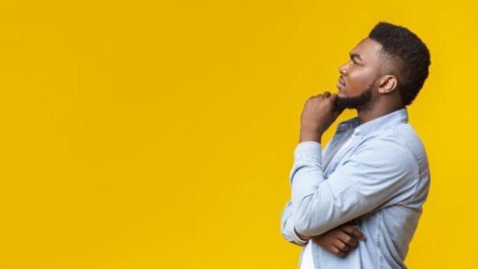What makes a guy hold back on asking a girl out?
