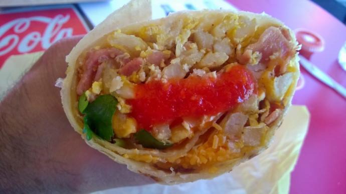 How do you apply your hot sauce on your burrito when eating? on each bite, in a dip or do you put it all on before you eat it?